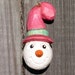 Smiling SNOWMAN WOOD CARVING Ornament, Pearl Pink & Green Hat - Hand Carved - Winter Decoration