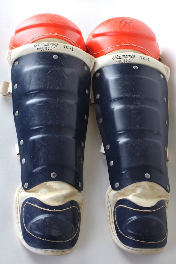 Catchers gear Rawlings blue and orange shin guards