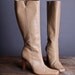 Size 8.5 Women's high heel zip up tan boots
