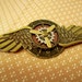 Steampunk Aviator Pin (M20-10) - Medal - Brass Wings and Clockface/Antique Brass - Gear and Brass Propeller are moveable