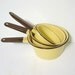 Vintage mellow yellow enamelware pans set of 3 with brown handles