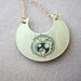 Doctor Who golden crescent with Gallifreyan symbol for TIME