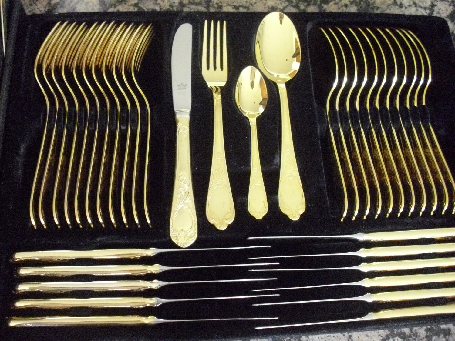 What are some retailers that sell gold-plated flatware?