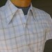 vintage 1960's Men's short sleeve shirt. White with plaid in light blue and brown. Big collar. 'New Old Stock'. Small.