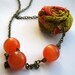 Fabric rosette necklace - Flower necklace asymmetrical necklace - orange beads - neon colors - colorful flower - orange and green