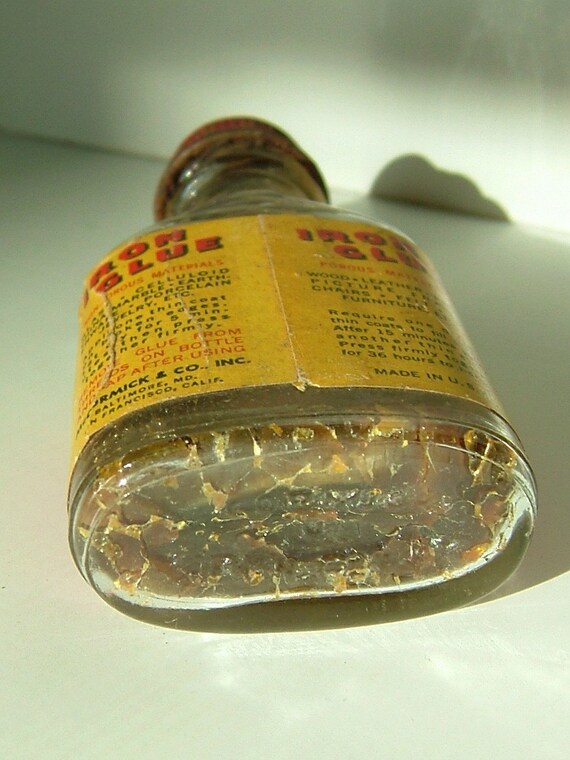 Antique McCormick Iron Glue Bottle