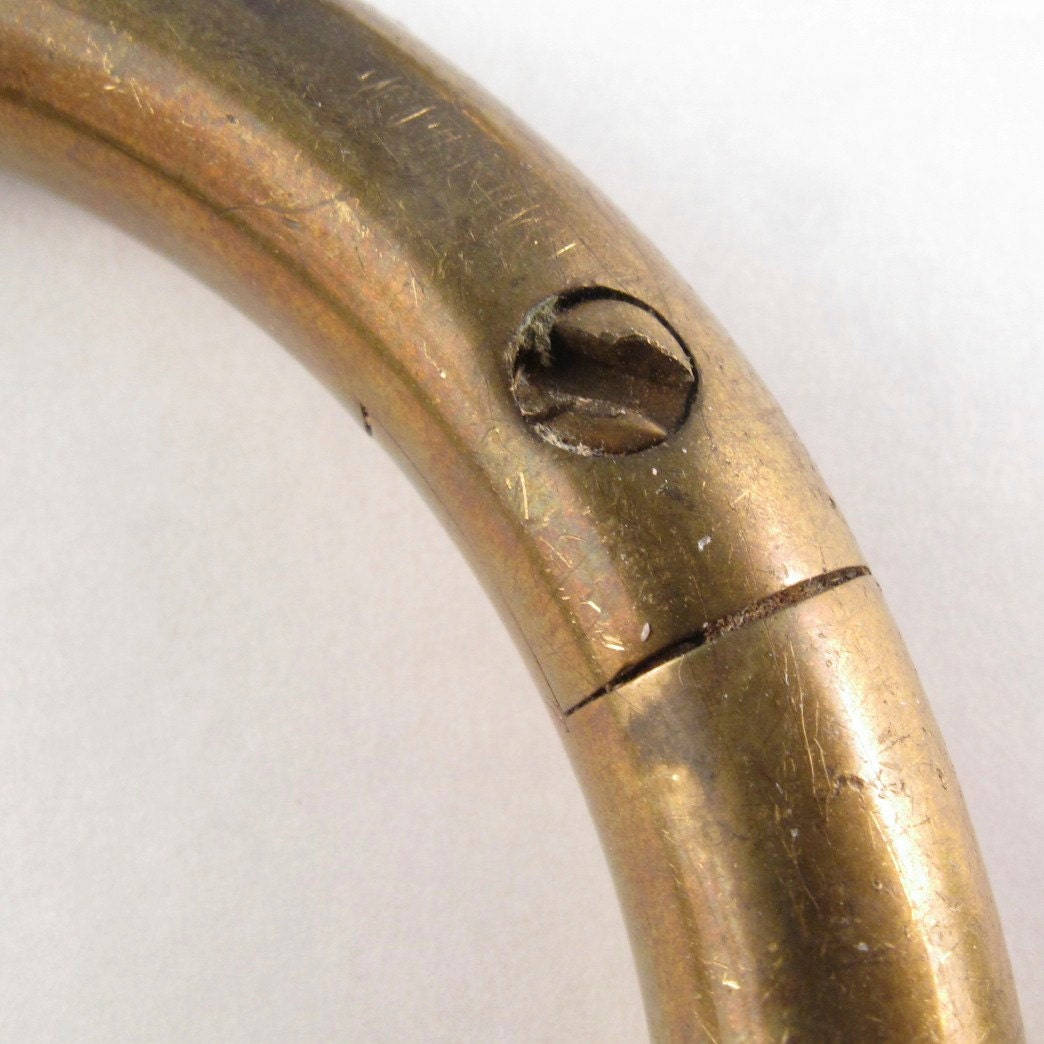 1 BULL NOSE RING. brass ring . self piercing . vintage.