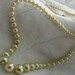 Nice heavy coated MILK GLASS pearls. 18 inch strand with traditional pearl necklace u hook catch.