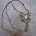 SALE - STEAMPUNK NECKLACE Pendant Grandfather Clock Gear Wrapped with Butterfly Filigree and Small Cameo