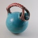 Unique little Pitcher with Artistic Handle and Spout Design