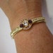 Gold Plated Hinged Bangle with Purple & White Rhinestones