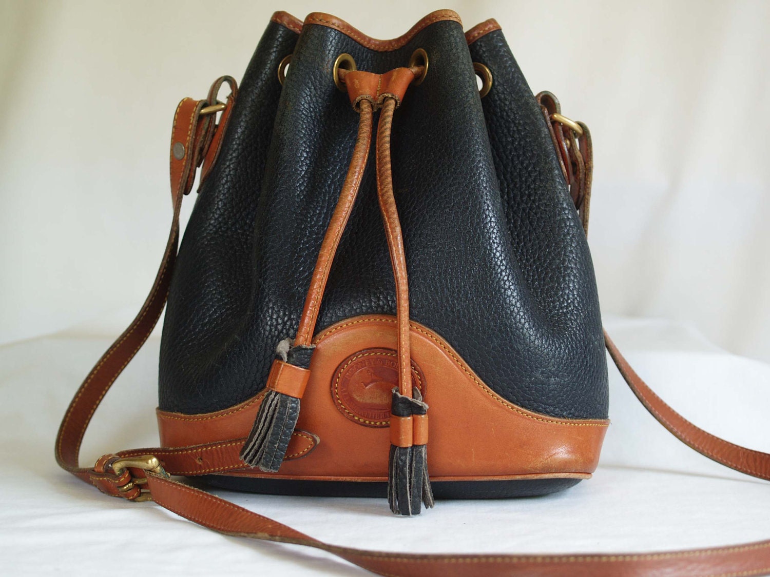 dooney and bourke all weather leather drawstring bag