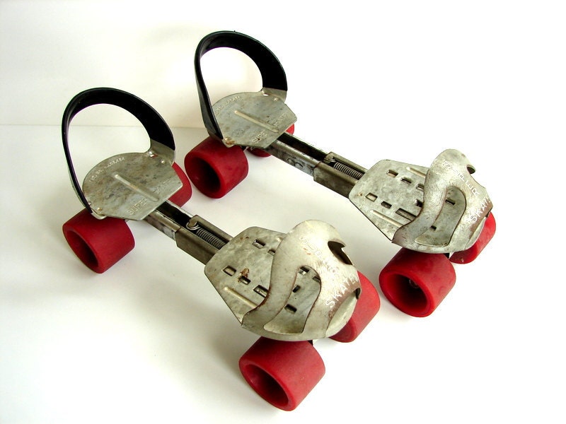 Vintage Adjustable Metal Roller Skates with Red Wheels Home
