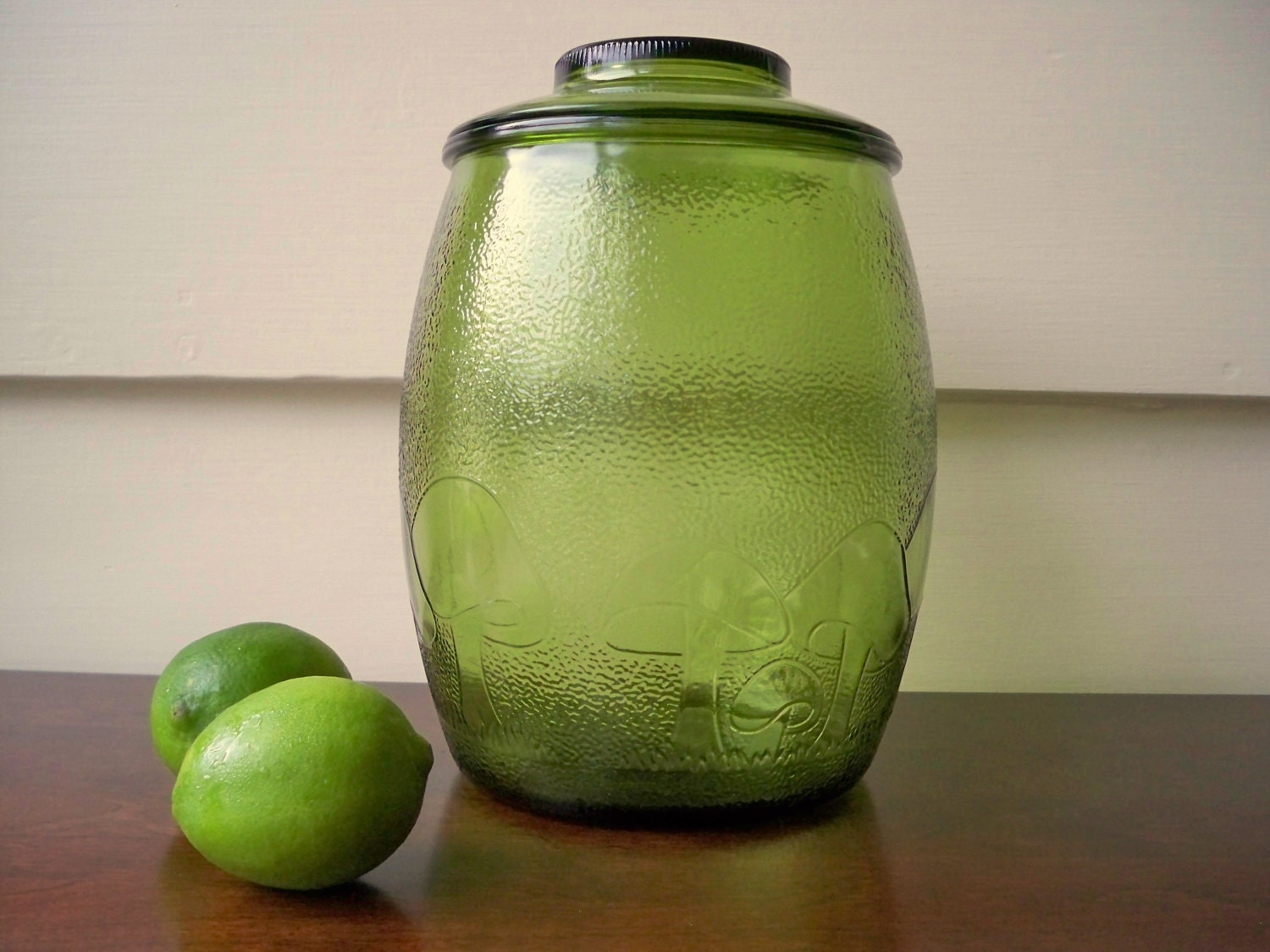 Vintage mushroom embossed glass canister. Green glass