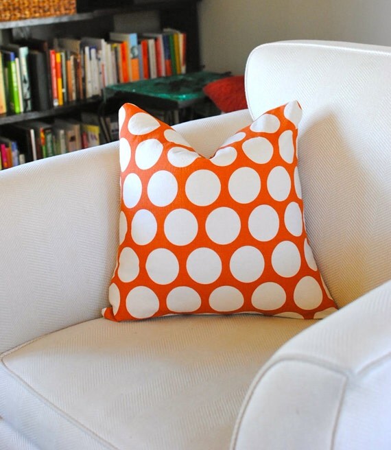 Polka dot pillows in burnt orange and off white. Set of two
