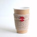 Natural cup cozy with red coconut button by The Cozy Project