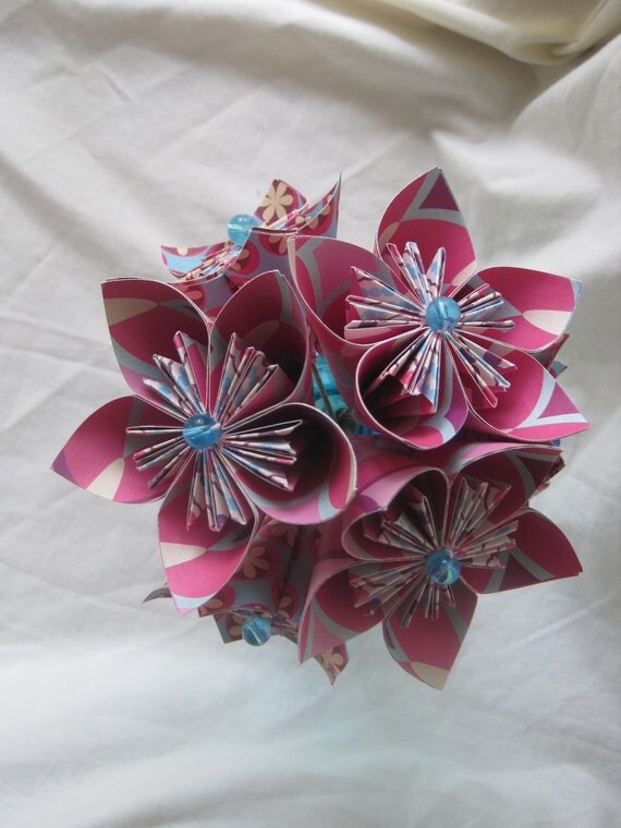 Bright pink and light blue paper flower arrangement in aqua