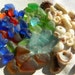 Red, blue, green, amber sea glass, shells, tinies for lockets or bottles.