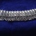 Vintage Eastern silver toned piece, pendant, necklace or bracelet. Features rhinestones. 5.4" ins long X 1.25" tall. VFMC11.5-12.2-19.1
