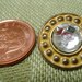 5 Metal and glass vintage buttons. 2 pairs of matching buttons and one larger but matched one set of smaller. UNK/P11.11-12.3-11.1