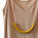 not quite a semi circle makes a necklace