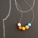 not quite round handmade beads make a necklace