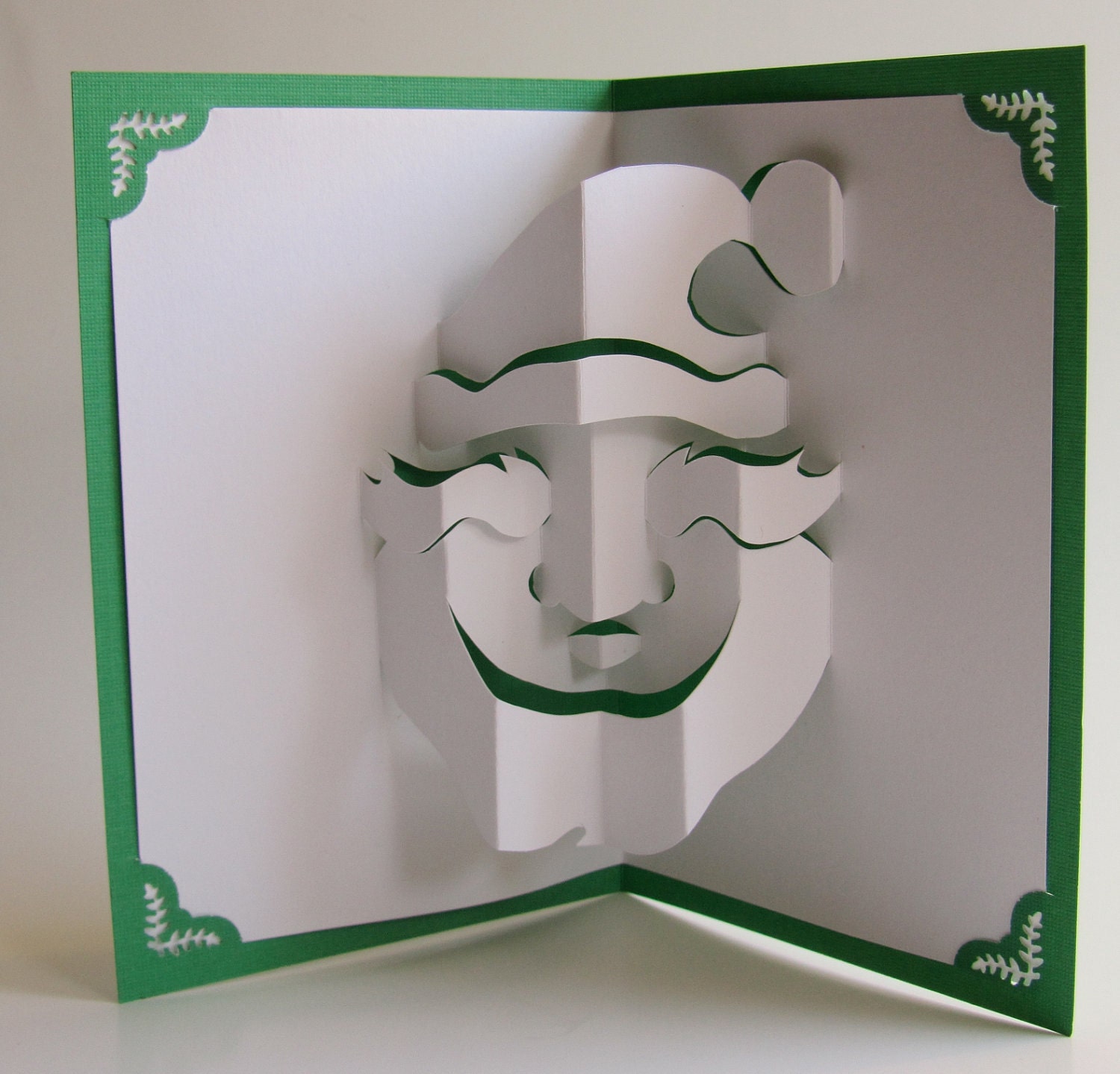 Santa Claus Christmas Pop Up Card Home Décor 3D Handmade Cut by Hand Origamic Architecture in Forest Green and White.