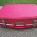 Red suitcase luggage overnight bag