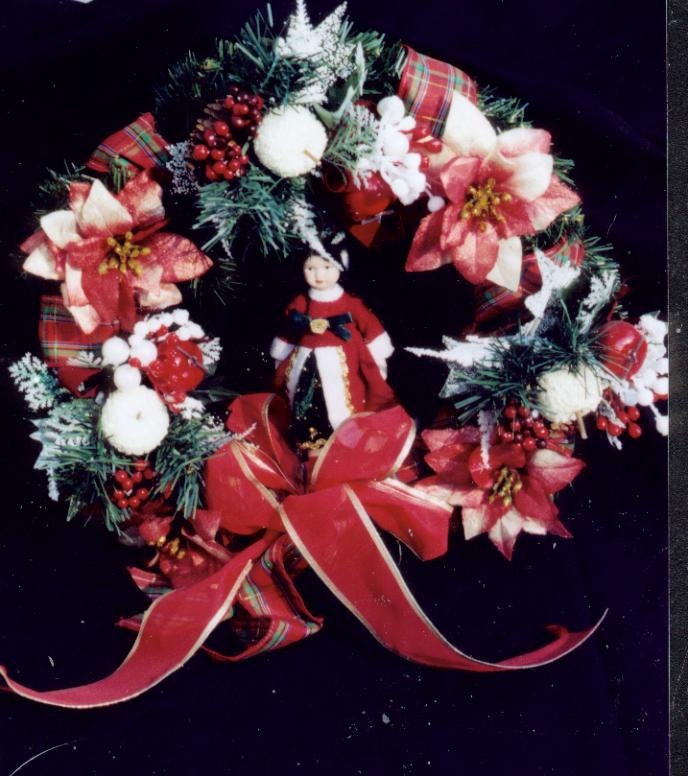 Christmas wreath with festive doll ornament