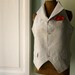 Updated classic vest. Stone with grey pinstripes and high collar.