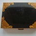 Vintage Swiss Black and Gold Musical Compact Playing Brahms Lullaby