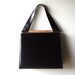 Black Kelly Style Triangle New York Handbag with Gold Trim