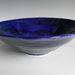 Electric blue bowl with black and green swirls