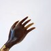 Back scratcher, wood and imitation horn AKA plastic