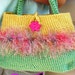 Crochet purse adorned with fun fur