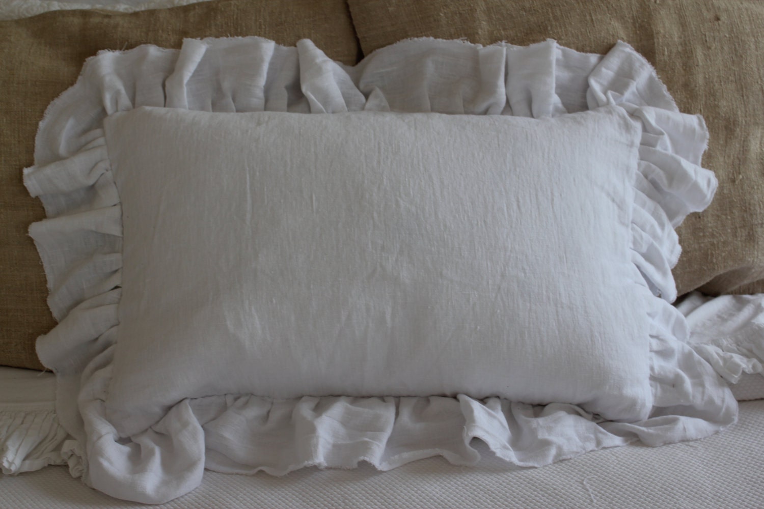 rectangular white linen pillow sham with raw edged ruffle