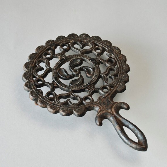 Items similar to Vintage Cast Iron Trivet with Hearts and Floral Design