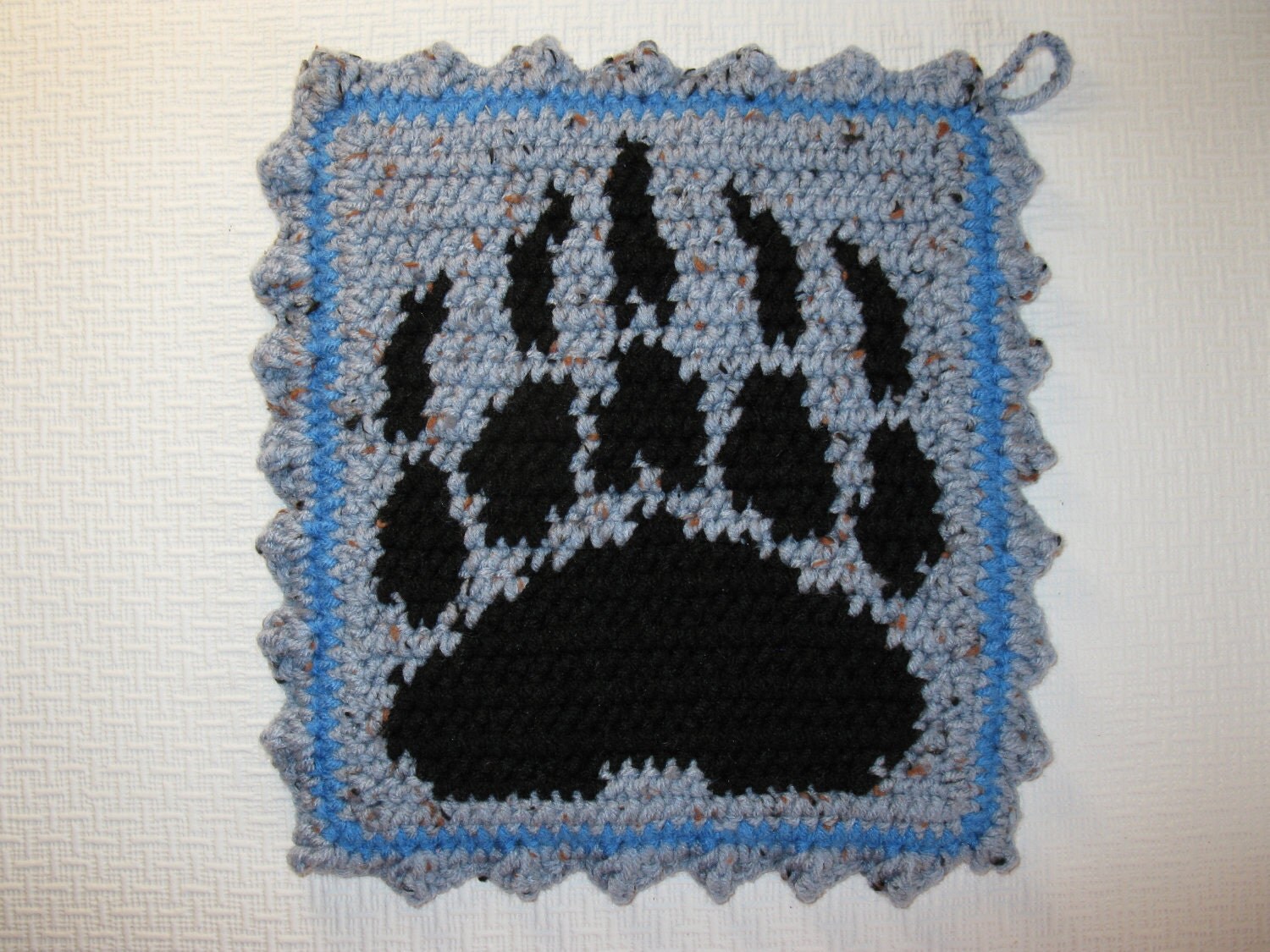 Bear Paw print Pot Holders. Blue potholders with black bear