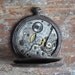 Antique pocket watch case with movement.