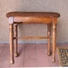 Vintage needlepoint bench footstool ottoman fluted legs brown background with flowers