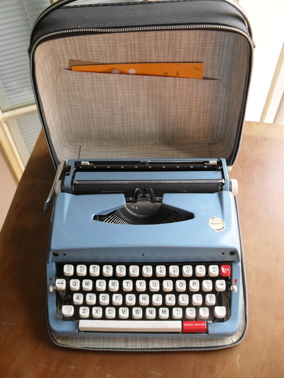 Vintage Brother portable typewriter blue with dark blue case