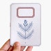 notebook fern plant blue and red label