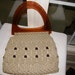 This Handbag is an Extraordinary Example of Vintage Macrame and Beads with Root Beer Colored Plastic Handles