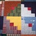 Log Cabin Quilt, Hand quilted, Traditional red center square, Blues and Greens, Yellow, Aqua, Multi