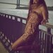 Rumple (Brown, Yellow, Cream, and Tan Romper in Floral Pattern with cinched waste and tube top) cut, pockets,