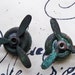 Two small Steampunk propeller stampings, patina