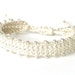 Cream white friendship bracelet, beaded and crocheted with adjustable knot & silver plated heart tag 'Made with Love'