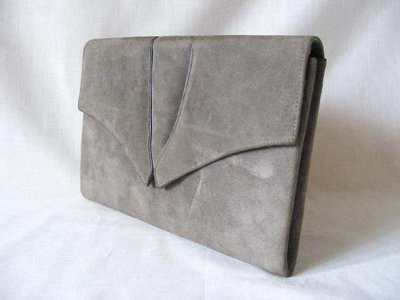 grey and white clutch bag