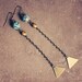 adelaine. a pair of teal and gold geometric earrings.