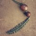 bellarosa. a long feminine peach and brown feather necklace.